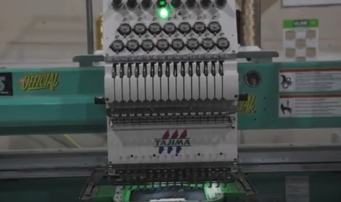Tajima Digital Embroidery Machine to create Custom Apparel at SwagTex